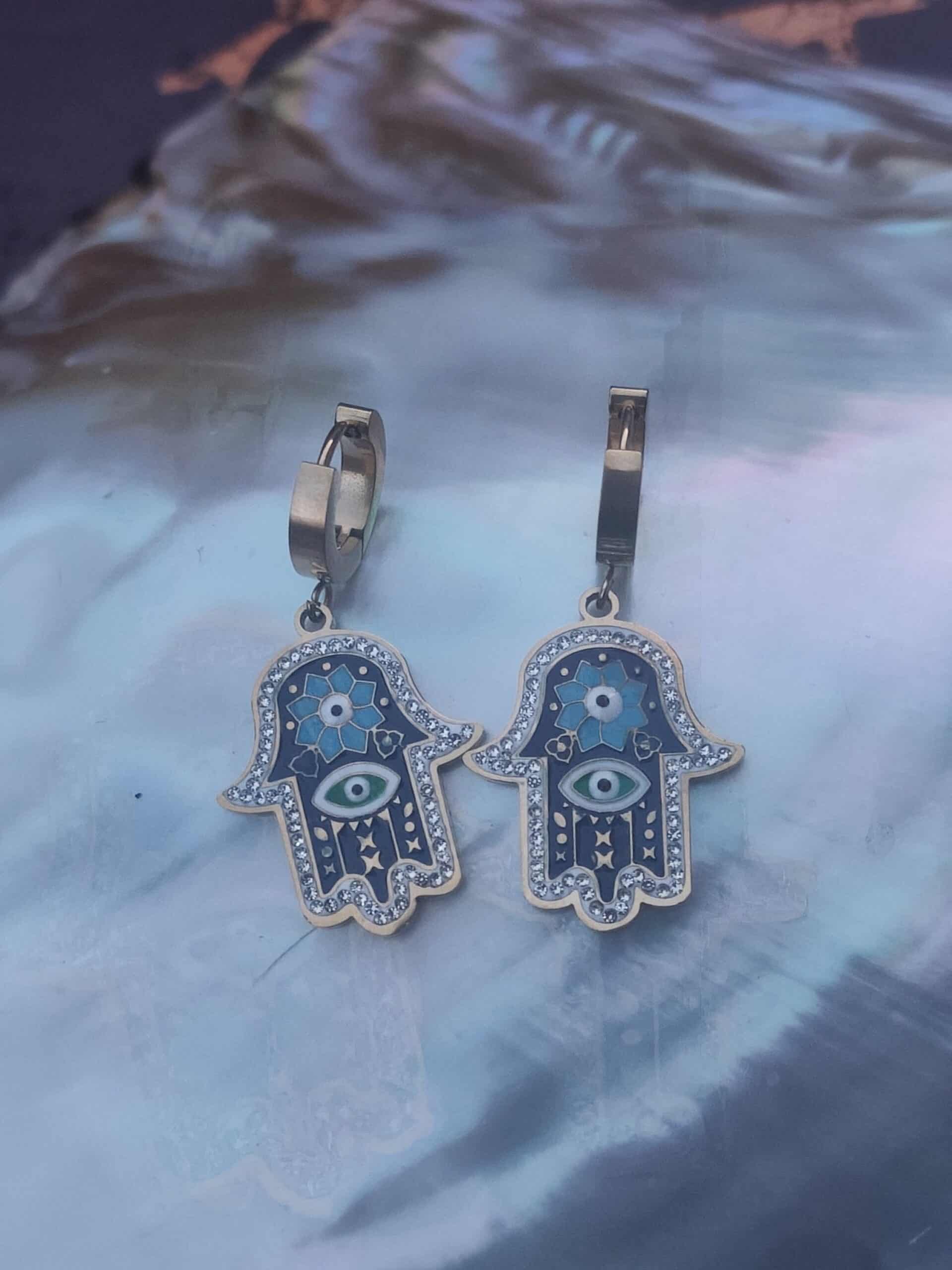 Boucle d'oreille main oeil